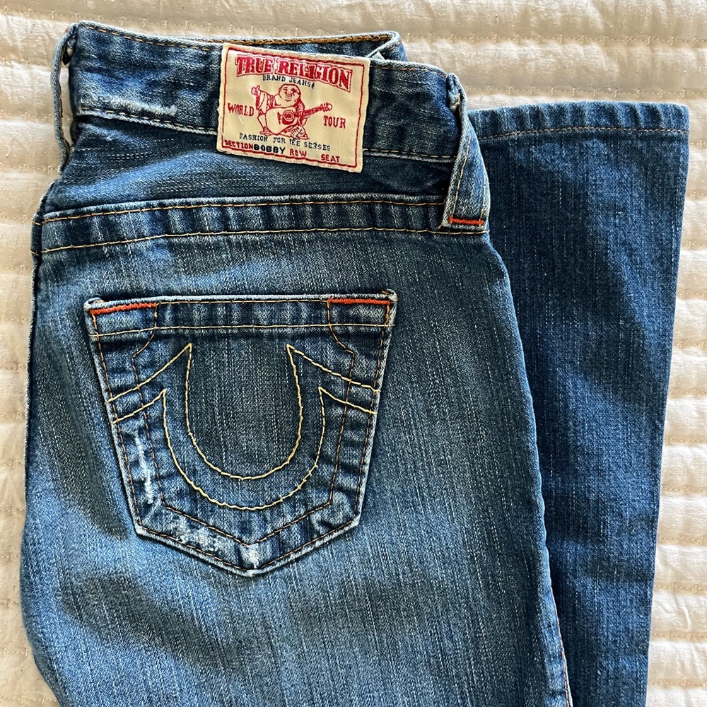 True Religion size 26 bootcut worn look . Inseam 28 inches . Excellent condition